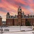 Sunset over snow covered Woodburn Hall at WV University